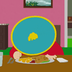 A Cartoon Character Sitting At A Table With A Plate Of Food In Front Of Him GIF