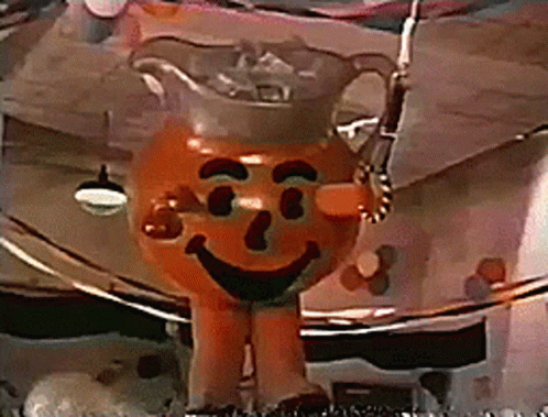 A Cartoon Character That Looks Like A Pitcher With A Face On It GIF