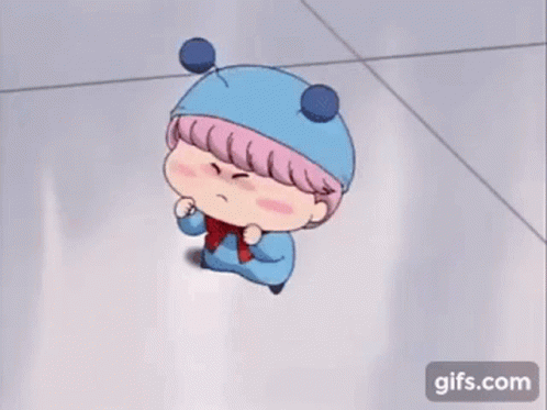 A Cartoon Character Wearing A Blue Hat And Scarf Is Standing On The Floor . GIF