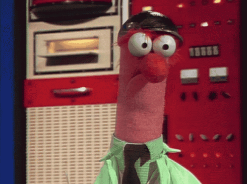 A Cartoon Character Wearing A Green Shirt And Tie Is Standing In Front Of A Red Wall With 8888 On It GIF