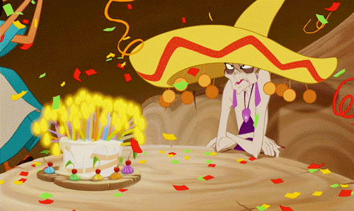 A Cartoon Character Wearing A Sombrero Is Sitting At A Table With A Birthday Cake GIF