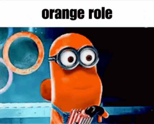 A Cartoon Character Wearing Glasses And Holding A Bag Of Popcorn With The Words `` Orange Role '' Written On It . GIF
