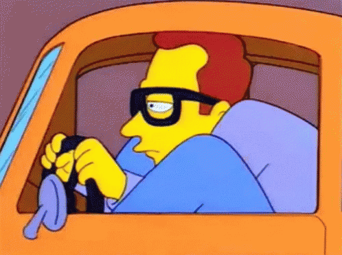 A Cartoon Character Wearing Glasses Is Driving An Orange Car GIF