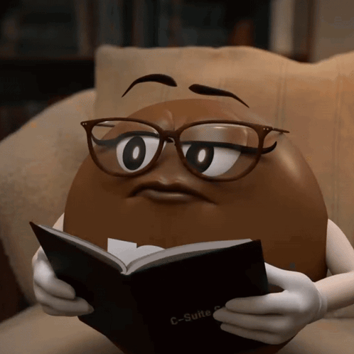 A Cartoon Character Wearing Glasses Is Reading A Book Called C-Suite GIF