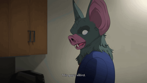 A Cartoon Character With A Bat Mask On Says " This Guy 'S Weird " GIF