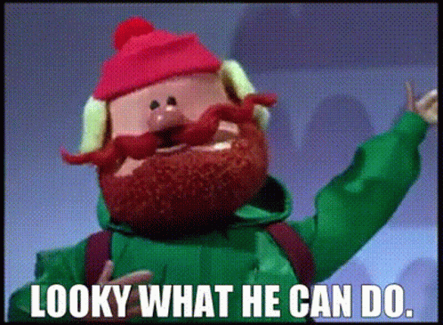 A Cartoon Character With A Beard And A Red Hat Says Looky What He Can Do GIF