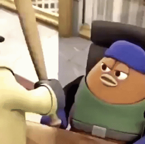 a cartoon character with a blue hat and a green shirt is sitting in a box .