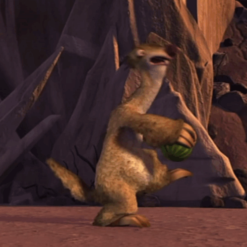 A Cartoon Character With A Green Ball In Its Mouth GIF
