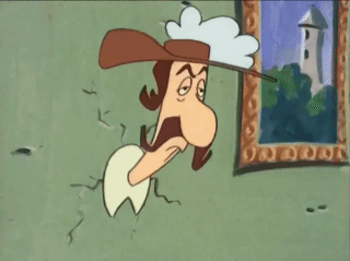 A Cartoon Character With A Hat And Mustache Is Hanging On A Wall Next To A Picture Frame . GIF