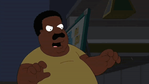 a cartoon character with a mustache and a yellow shirt stands in front of a computer monitor