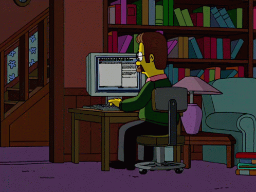 A Cartoon Character With A Mustache And Glasses Is Looking At A Computer Monitor GIF