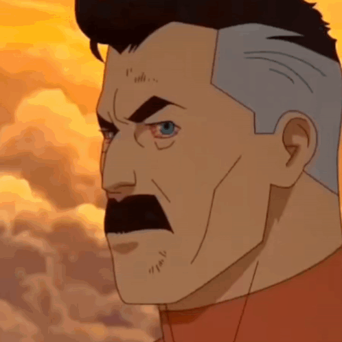 A Cartoon Character With A Mustache And Gray Hair Is Looking At The Camera . GIF