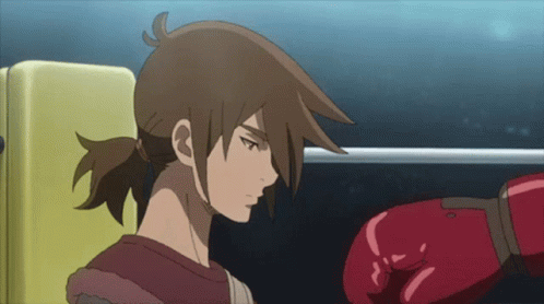 A Cartoon Character With A Red Boxing Glove On His Hand GIF