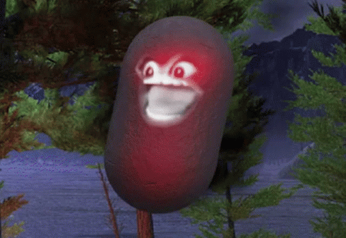 A Cartoon Character With A Red Face Is Hanging From A Tree GIF