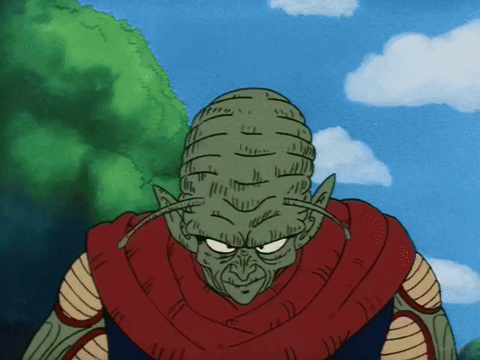 A Cartoon Character With A Red Scarf Around His Neck Is Looking At The Camera GIF