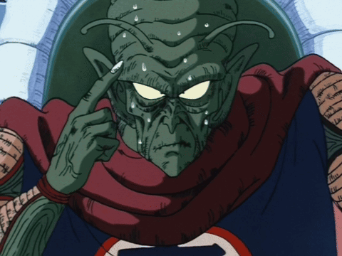 A Cartoon Character With A Red Scarf Around His Neck Is Pointing At His Face GIF