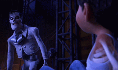 A Cartoon Character With A Skull On His Head Is Standing Next To Another Cartoon Character GIF