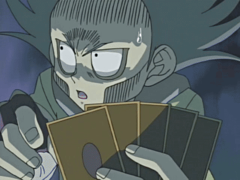 A Cartoon Character With A Surprised Look On His Face Holding A Deck Of Cards GIF