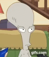 Cartoon Character With Large Head Sitting On Couch Reading GIF