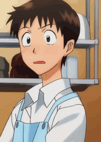 A Cartoon Character With A White Shirt And Blue Apron Making A Funny Face GIF