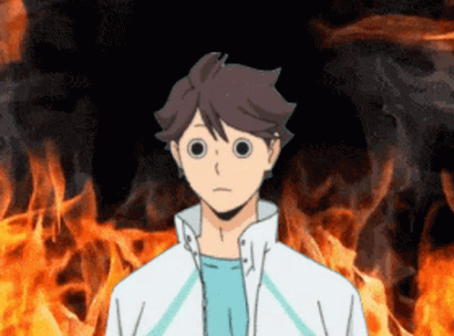 A Cartoon Character With Big Eyes Stands In Front Of A Fire GIF