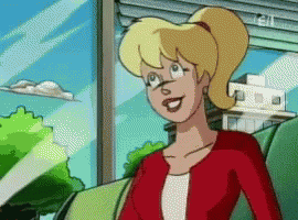 A Cartoon Character With Blonde Hair And A Red Jacket GIF