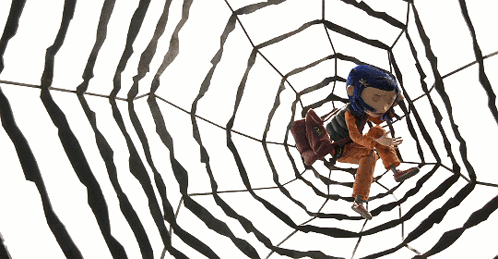 A Cartoon Character With Blue Hair Is Sitting In A Web GIF