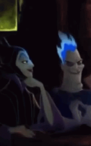 A Cartoon Character With Blue Hair Is Sitting Next To Another Cartoon Character And Making A Funny Face . GIF