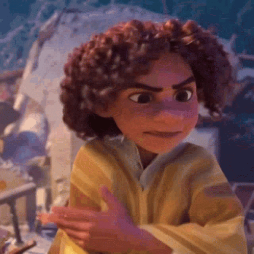 A Cartoon Character With Curly Hair And A Yellow Shirt Is Making A Funny Face . GIF