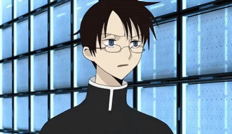 A Cartoon Character With Glasses And A T On His Chest GIF