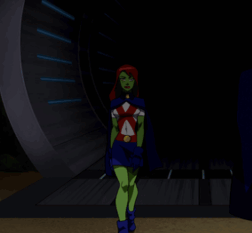 A Cartoon Character With Green Arms And Red Hair Stands With Her Arms Crossed GIF