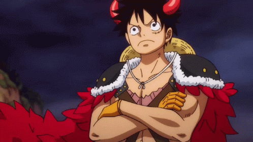 A Cartoon Character With Horns And A Straw Hat Stands With His Arms Crossed GIF