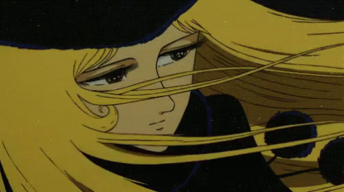 A Cartoon Character With Long Blonde Hair And A Black Hat GIF