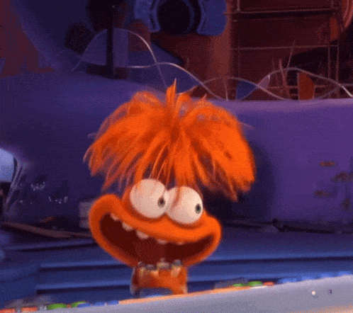 A Cartoon Character With Orange Hair Is Standing In Front Of A Purple Wall GIF