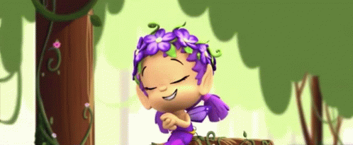 A Cartoon Character With Purple Flowers On Her Head Is Smiling GIF