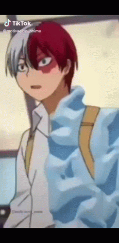 A Cartoon Character With Red And White Hair Is Wearing A Blue Jacket . GIF