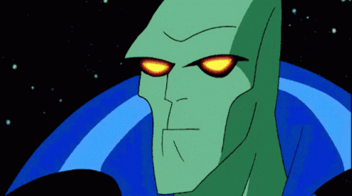 A Cartoon Character With Red Eyes And A Blue Cape Looks At The Camera GIF