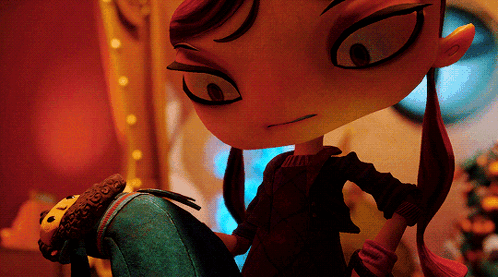 A Cartoon Character With Red Hair Is Standing Next To A Stuffed Toy GIF