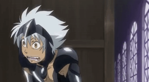 A Cartoon Character With White Hair And A Helmet Is Standing In Front Of A Fence . GIF