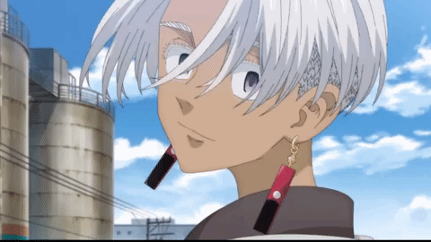 a cartoon character with white hair and red earrings stands in front of a silo
