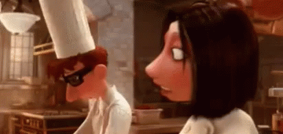 A Cartoon Chef And A Woman Are Standing Next To Each Other In A Kitchen . GIF