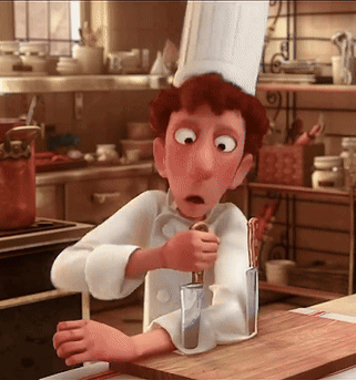 A Cartoon Chef Is Holding A Knife And A Spoon In A Kitchen GIF