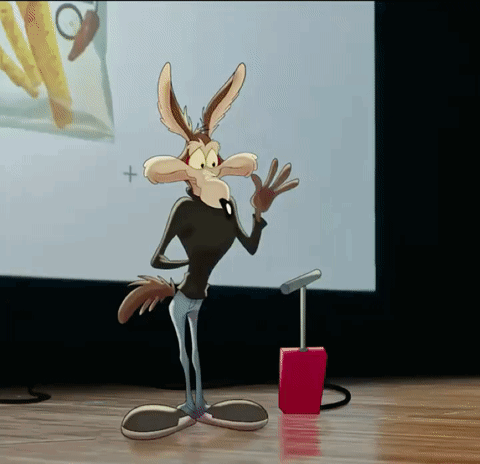 a cartoon coyote is standing in front of a screen with a plus sign on it