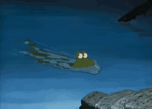A Cartoon Crocodile Is Swimming In A Body Of Water GIF