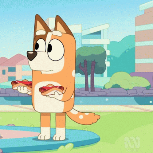 A Cartoon Dog Is Holding A Hot Dog In His Paws GIF