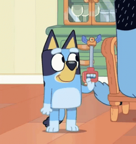 a cartoon dog is holding a toy gun in his hand