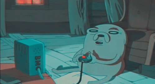 A Cartoon Dog Is Playing A Video Game With A Box That Says Bmc On It GIF