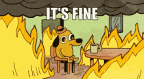A Cartoon Dog Is Sitting At A Table In Front Of A Fire With The Words " It 'S Fine " Written Above Him GIF