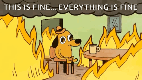 A Cartoon Dog Is Sitting At A Table In Front Of A Fire With The Words `` This Is Fine ... Everything Is Fine '' Above Hi GIF