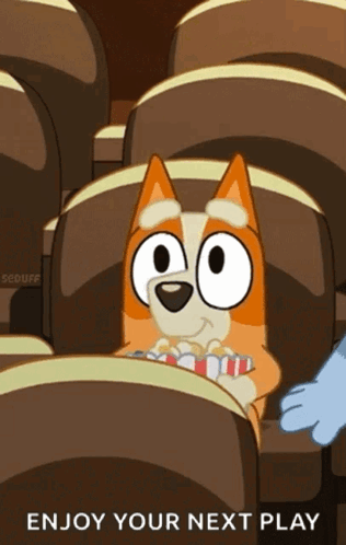 A Cartoon Dog Is Sitting In A Theater Eating Popcorn GIF